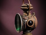 a very old lamp that is sitting on a table