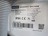 a close up of a samsung washing machine label on the side of the machine