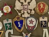 a belt with a lot of badges on it