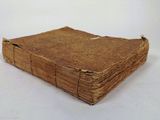 an old book that is sitting on a table