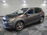 a picture of a grey car parked in a garage