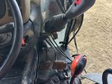 a close up view of the steering and dashboard of a tractor