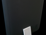 a black binder with a white button on it
