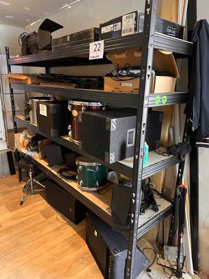 a shelf with many different types of electronics on it