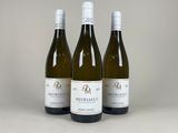 three bottles of wine sitting on top of a table next to each other