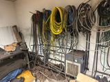 a room with a bunch of wires on the wall and a lot of wires on the floor