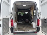 a white van with its doors open in a parking lot