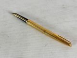 a close up of a pen on a white surface