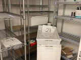 a refrigerator that has a lot of shelves in it