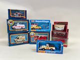 six different types of toy ambulances in the box
