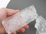 a person holding a piece of ice in their hand