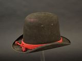 a brown hat with a red cord on it