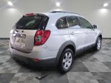 a picture of a white suv parked in a garage