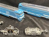 three toy trains that are sitting on a table