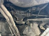 a close up view of a car ' s engine and exhaust pipes