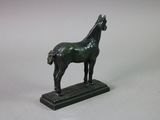 a statue of a horse that is standing on a base