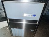 an image of a stainless steel ice maker in a warehouse