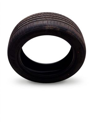 a tire that is sitting on a white surface