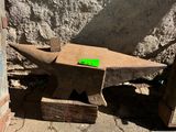 a bench made out of a piece of wood with a green label on it