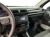 the interior of a car with a steering wheel and dashboard controls
