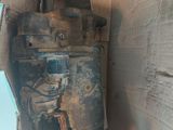 a cardboard box with a broken engine inside of it