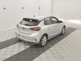 the back end of a white car is parked in a garage