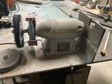 a machine that is sitting on a table in a garage