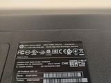 a close up of a laptop with a sticker on the back of it