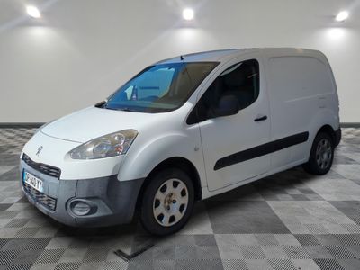the white van is parked on a checkered floor in a room