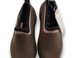 pair of women ' s brown shoes with a tag on the side