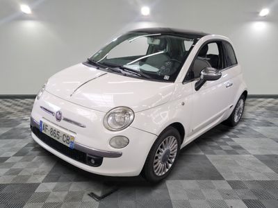 a picture of a small white car on a checkered floor