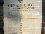 a large piece of paper on display in a glass case