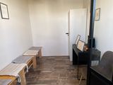 a room with benches and a table in it