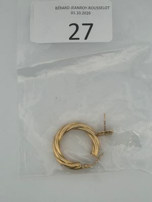 a small piece of gold wire in a plastic bag
