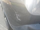 a close up of a car ' s front bumper and fender