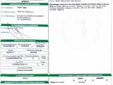 a green and white document with a barcode on it