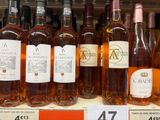 many bottles of wine on the shelf in the store
