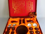 a wooden box with a set of chocolates in it