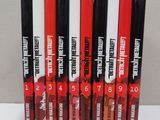 four lip glosses are lined up on a white surface