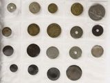 a lot of different types of coins on the table