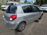 a silver car that is parked in a parking lot
