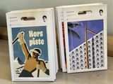 two bags of cigarettes on a table next to each other