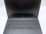 a close up of a laptop computer on a white surface