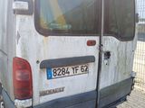 a white van that is parked on the side of the road