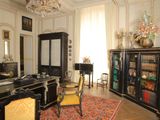 an image of a living room with a desk and a chair