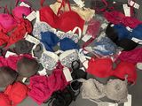 a lot of bras that are on a table