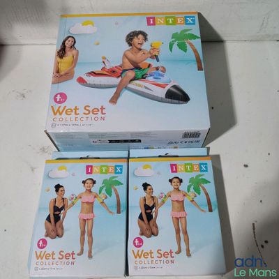 two boxes of wet set toys sitting on top of a table