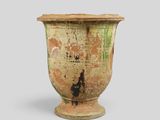 an old vase with a rusted design on it