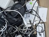 a cardboard box full of electronic devices and wires