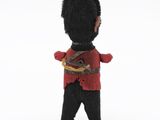 a toy soldier that is holding a knife in his hand